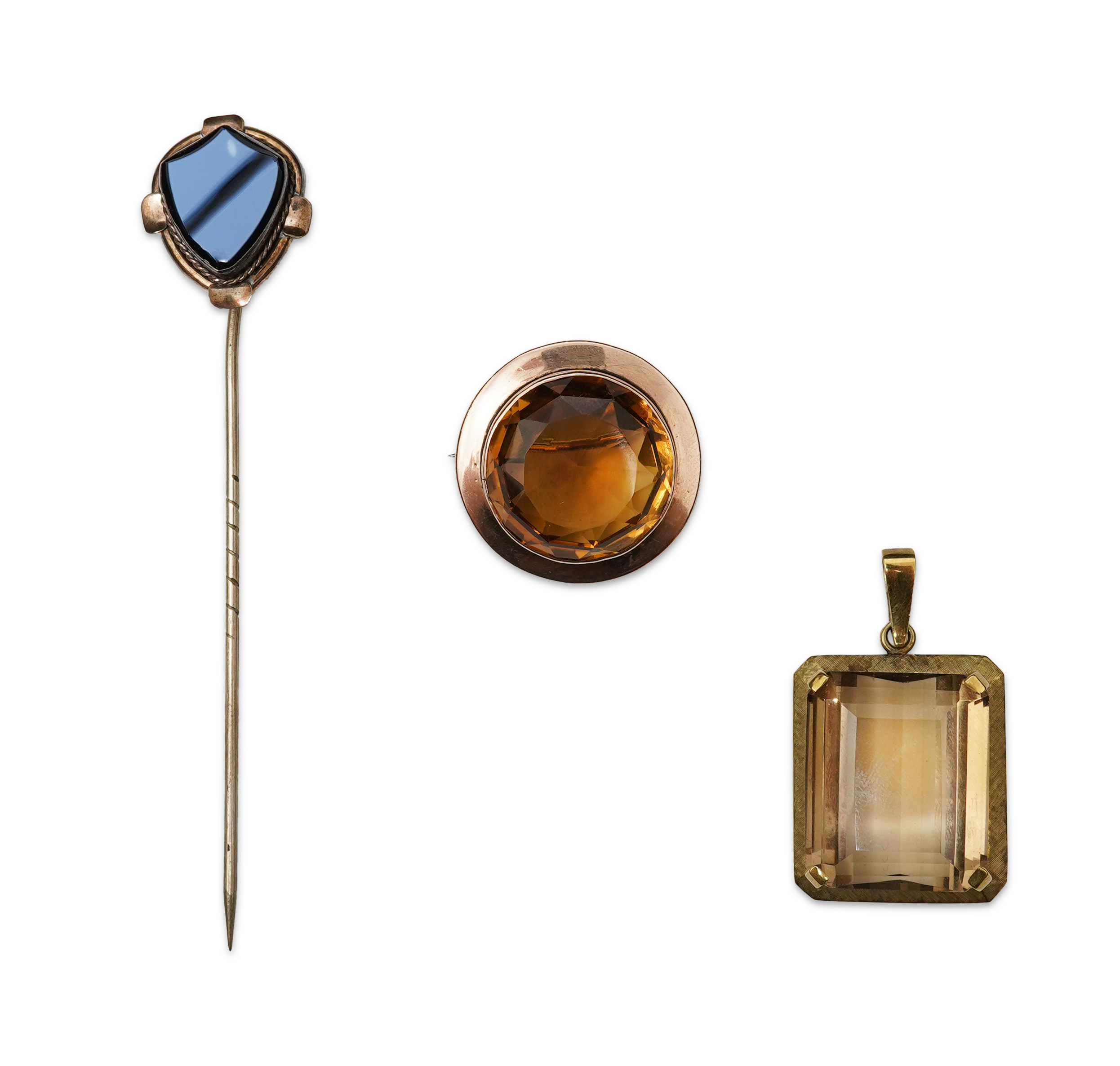 A citrine brooch and pendant, and onyx stickpin